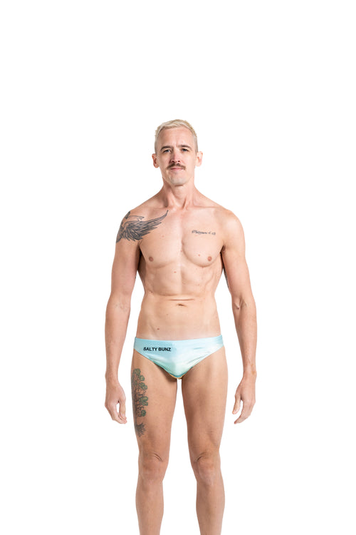 Salty Bunz Coastal Swim Brief Life on the Beach Classic 4.5cm with white background front Gay swimwear Model Bevan