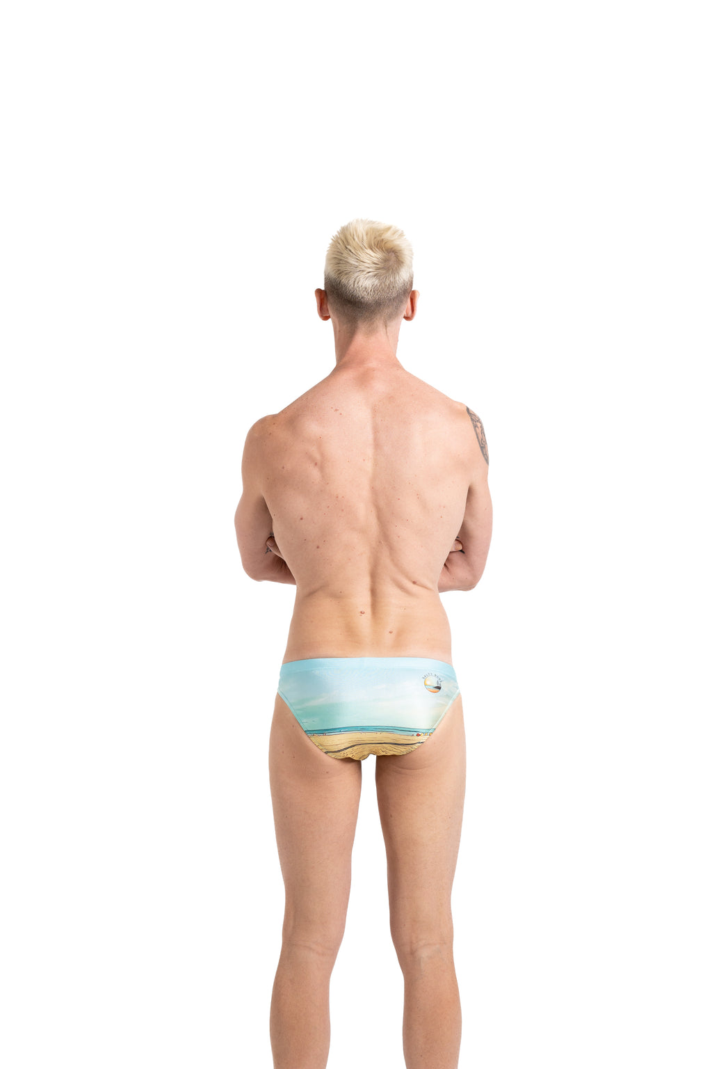 Salty Bunz Coastal Swim Brief Life on the Beach Classic 4.5cm with white background rear Gay swimwear Model Bevan