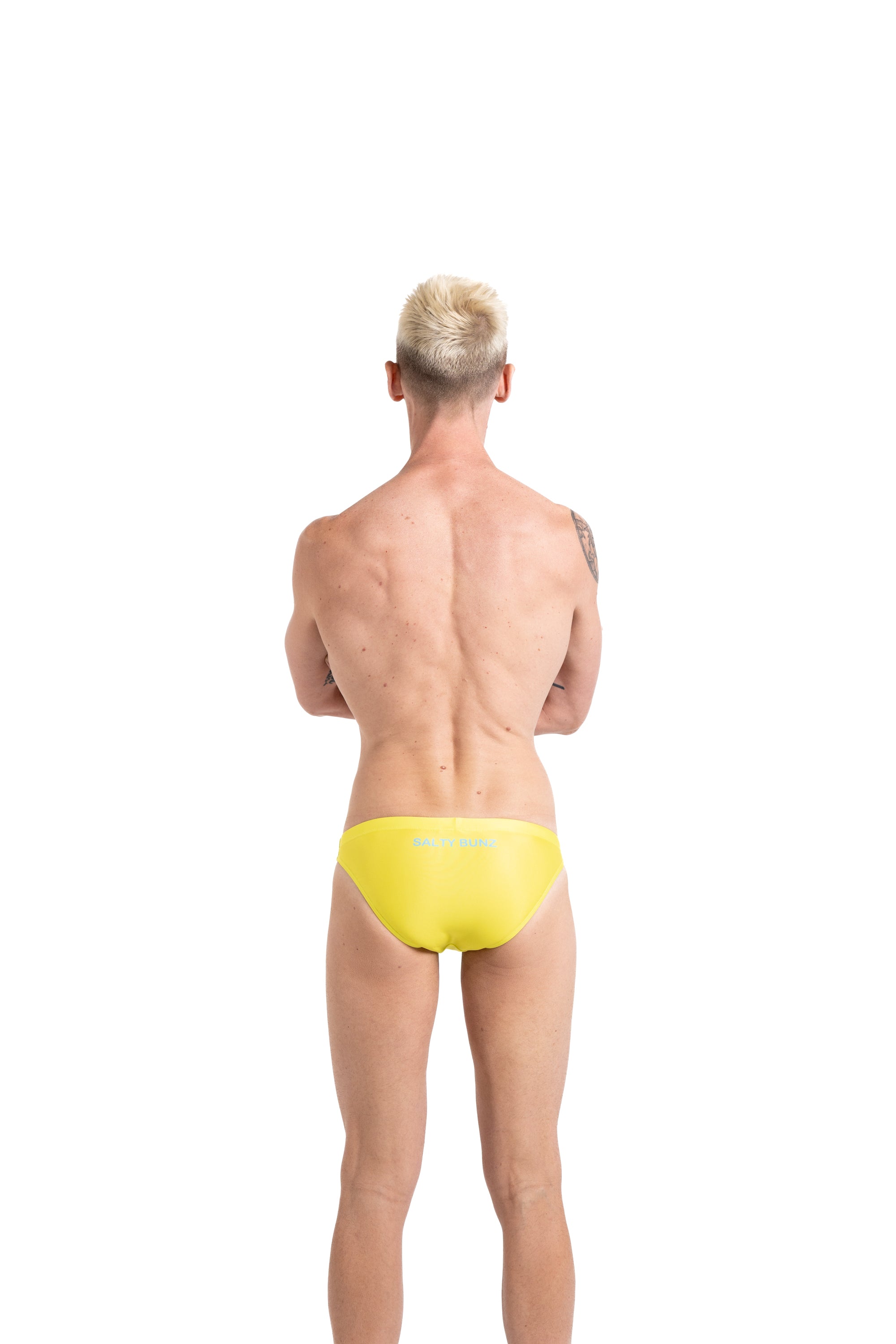 Salty Bunz Bikini Swim Brief Ultra-Thin 3.5cm Citrus Current Yellow with white background rear Gay swimwear Model Bevan