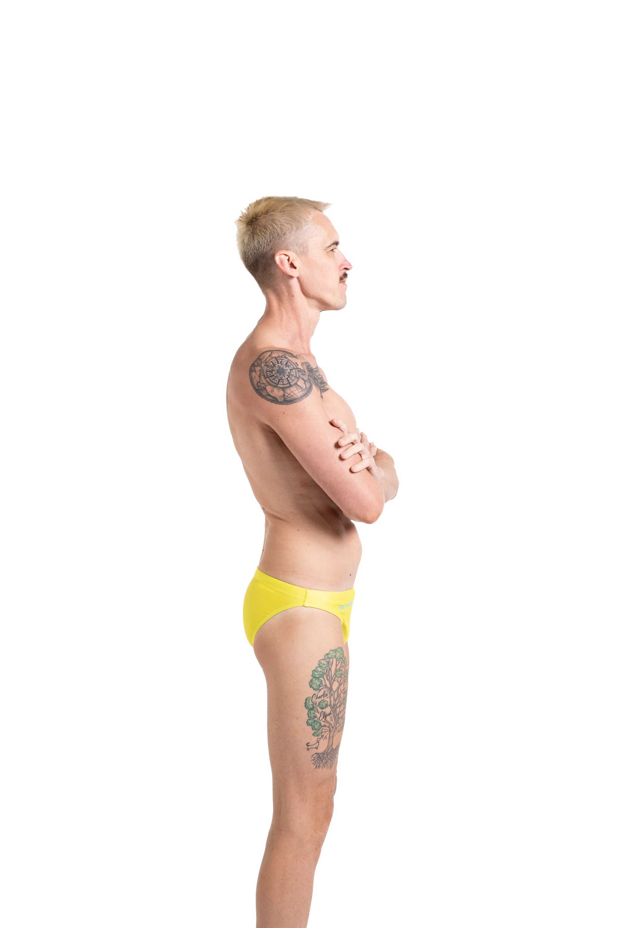 Salty Bunz Bikini Swim Brief Ultra-Thin 3.5cm Citrus Current Yellow with white background right side Gay swimwear Model Bevan