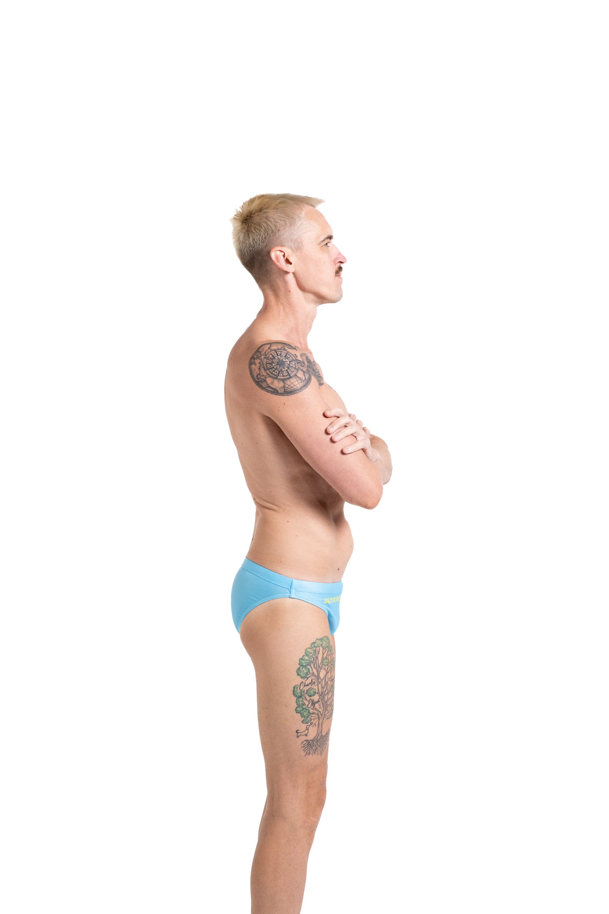 Salty Bunz Bikini Swim Brief Ultra-Thin 3.5cm Ocean Oasis Sky Blue with white background Gay swimwear Model Bevan right side